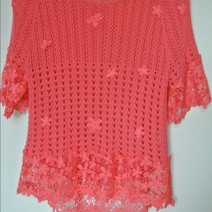 Tangerine knitted top, with flowers.